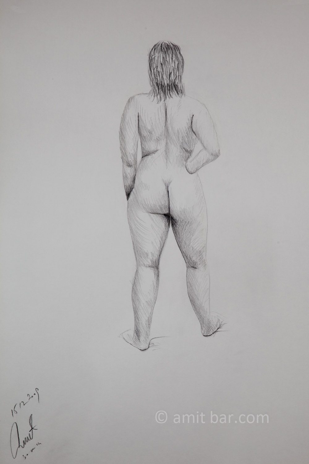 A nude model from behind with her right hand on her hip. Pencil