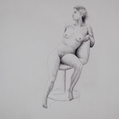 A nude model sitting on a turning-chair