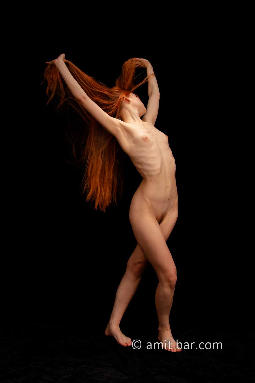 Ameria dancing III: Model Ameria is dancing in my studio and waving with her beautiful red hair