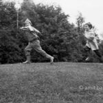 A boy is chasing his brother