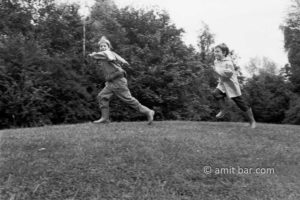 A boy is chasing his brother