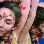 Autumn leaves body-painting III: Portrait of a body-painted model with autumn leaves