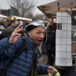 Berlin: Cat Eyes. A visitor at the Sunday market