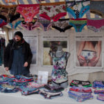 Berlin: Upstairs, Downstairs. Lingerie seller on the Sunday market