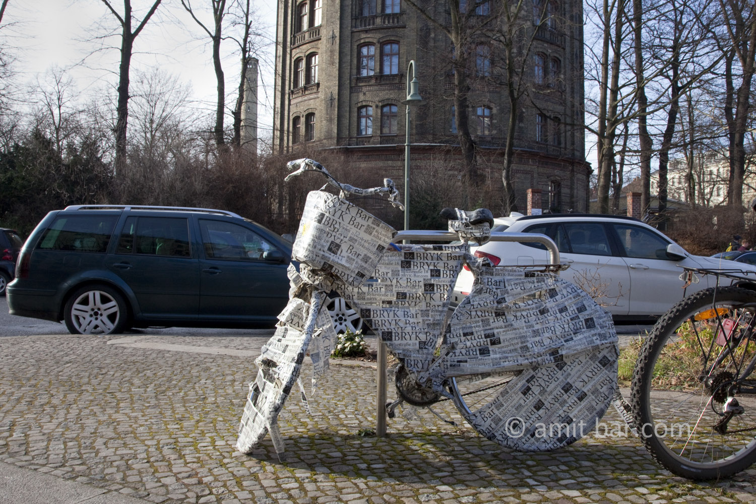 Berlin: Wrapped Bike are parked on street.