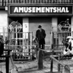 A farmer is looking at his cows on the cattle market