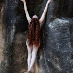 Photo 3-I: Nude model at a black rock