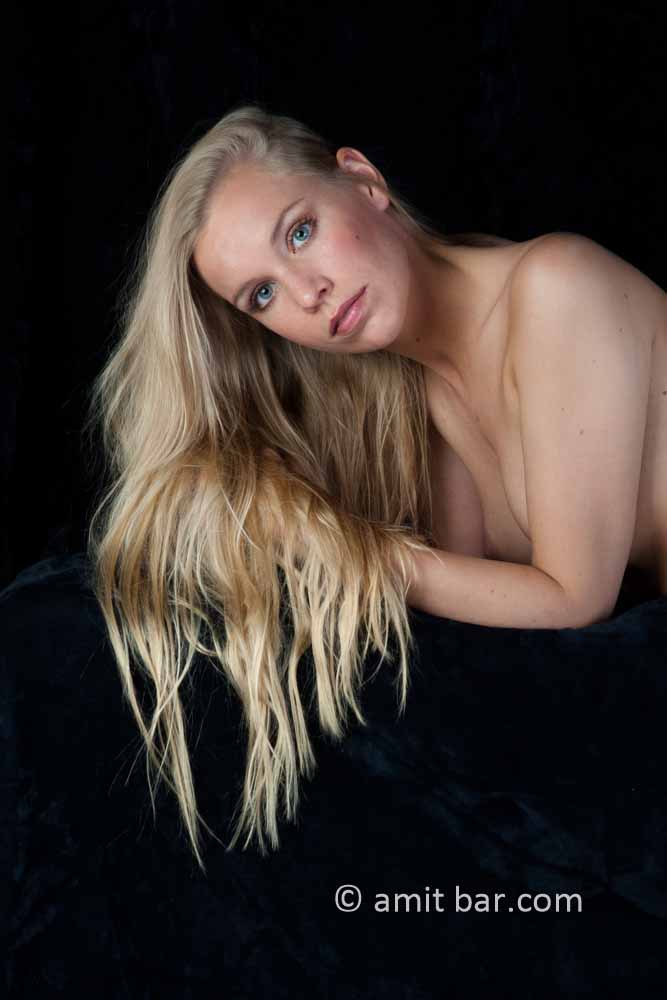 Blonde II: Blond nude model with black background
