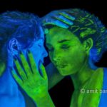 Blue and green III: Two body-painted models in UV blue and green
