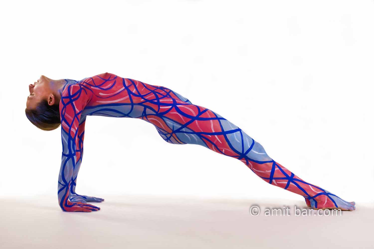 Blue and Red I: Body-painted yoga model in blue and red
