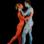 Blue and red tango I: Body painted dancers in blue and red