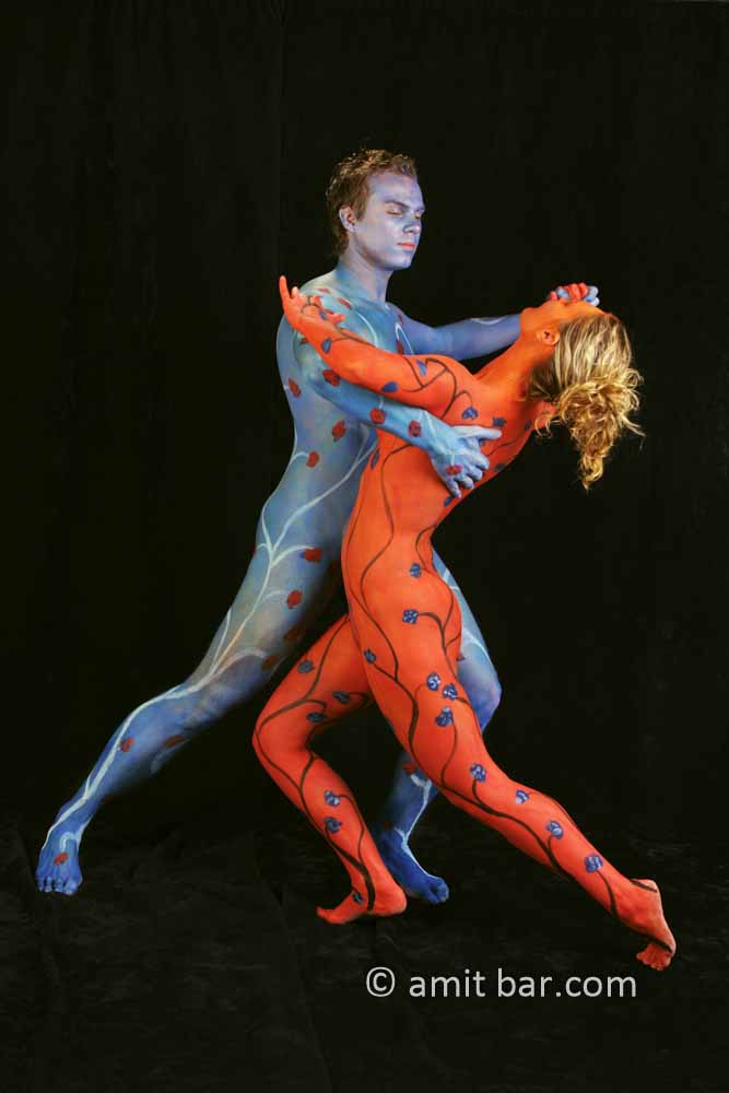 Blue and red tango II: Body painted dancers in blue and red