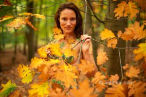 Body painted autumn leaves IV: Autumn leaves painted on a model in the forest beside Doetinchem, The Netherlands
