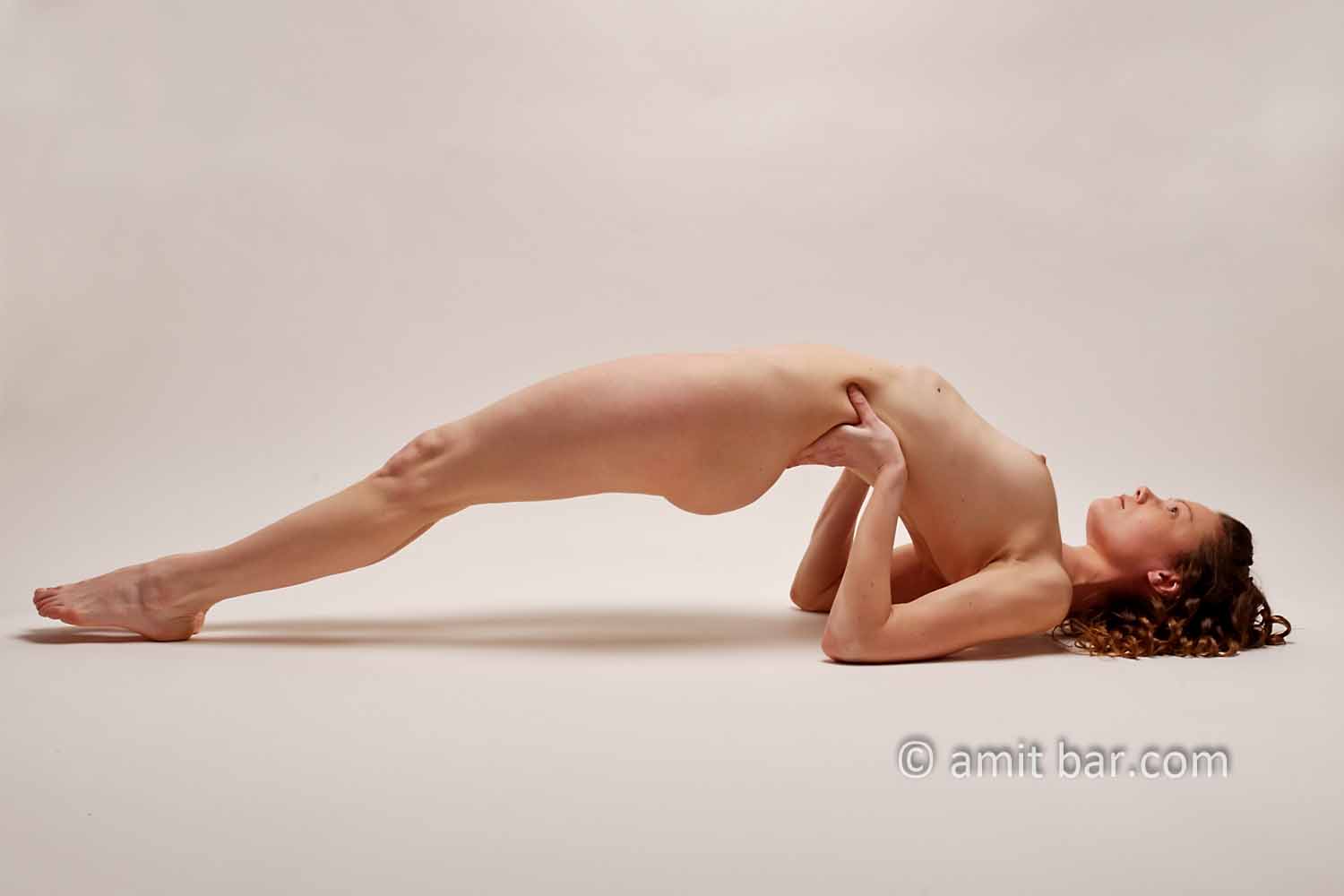 Bridge: Nude model creates bridge with her back