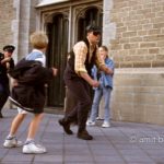 Catch the thief!: Two actors dressed as a thief and policeman are chasing each other at street theater festival in Doetinchem, The Netherlands