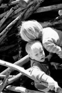Climbing together: Two boys playing