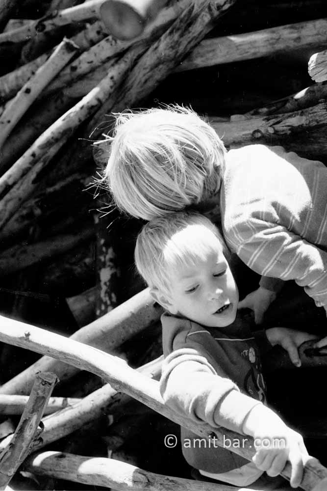 Climbing together: Two boys playing