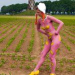 Clog dance I: Body-painted model dancing with Dutch wooden shoes near the windmill of Bronkhorst