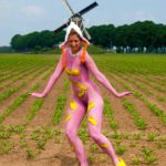 Clog dance III: Body-painted model dancing with Dutch wooden shoes near the windmill of Bronkhorst