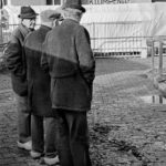 Clogs: Four farmers in discussion on the cattle-market in Doetinchem, The Netherlands