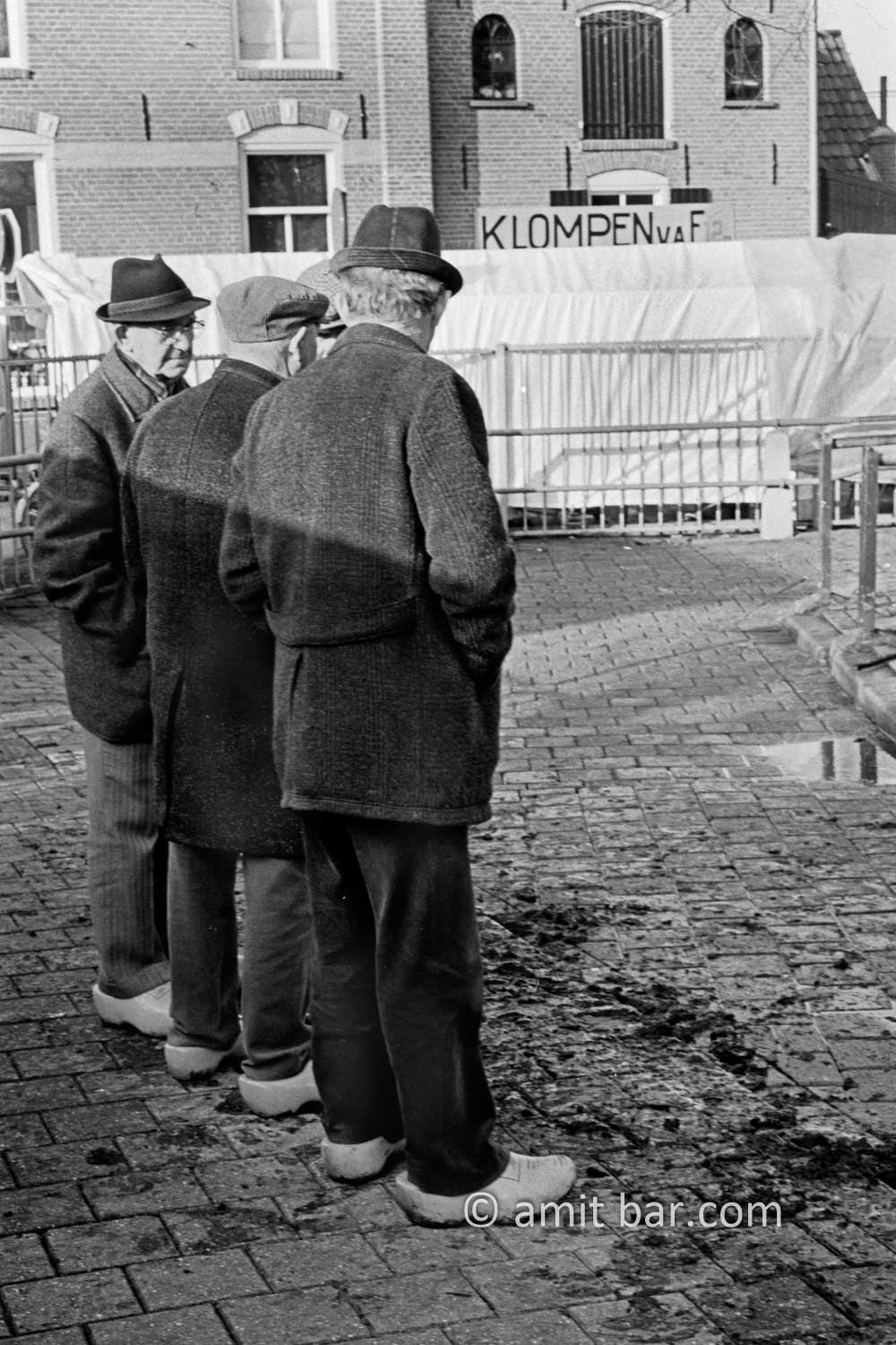 Clogs: Four farmers in discussion on the cattle-market in Doetinchem, The Netherlands