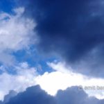 Clouds II: black and white clouds in blue sky