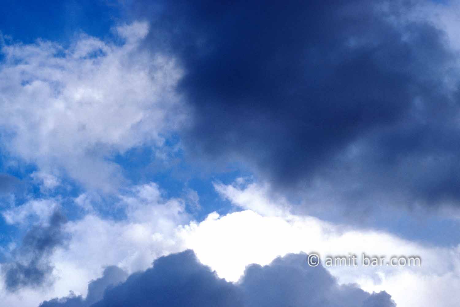 Clouds II: black and white clouds in blue sky