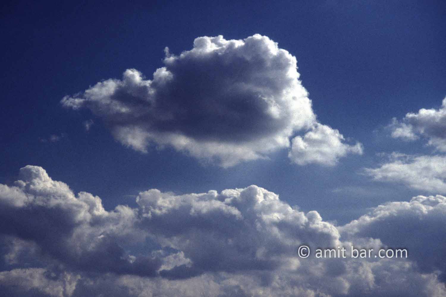 Clouds IX: black and white clouds in blue sky