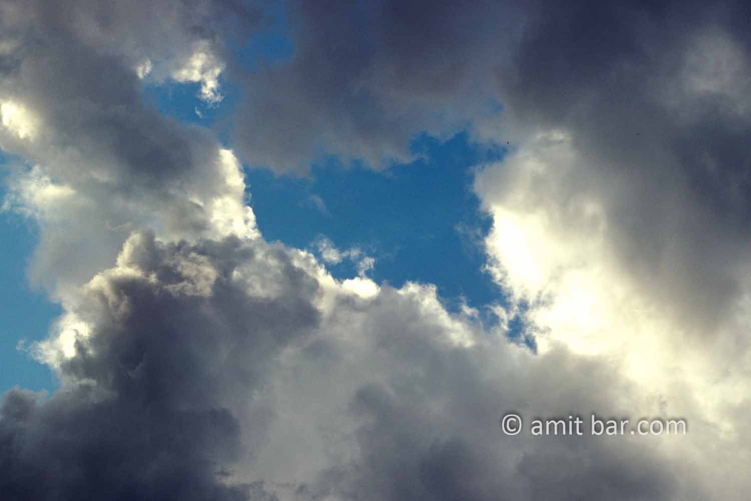 Clouds VI: black and white clouds in blue sky