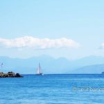 Corfu: Clouds, mountains and sailing boat: Clouds, mountains and sailing boat at Corfu