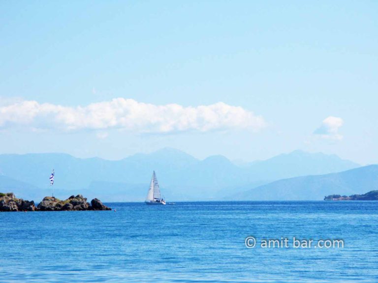Corfu: Clouds, mountains and sailing boat