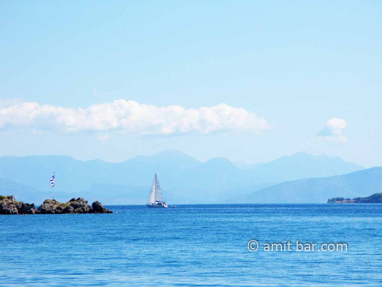 Corfu: Clouds, mountains and sailing boat: Clouds, mountains and sailing boat at Corfu