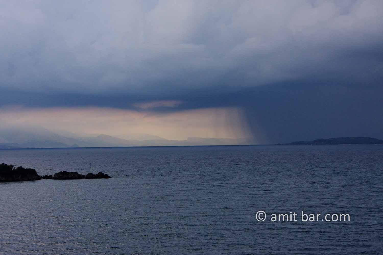Corfu: Storm above Corfu: Rainstorm above Corfu city, Greece