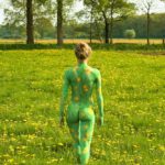 Dandelions I: Body-painted model in a field with dandelions