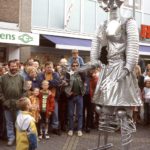 David and Goliath: A child is watching a huge robot on Street theater festival in Doetinchem, The Netherlands