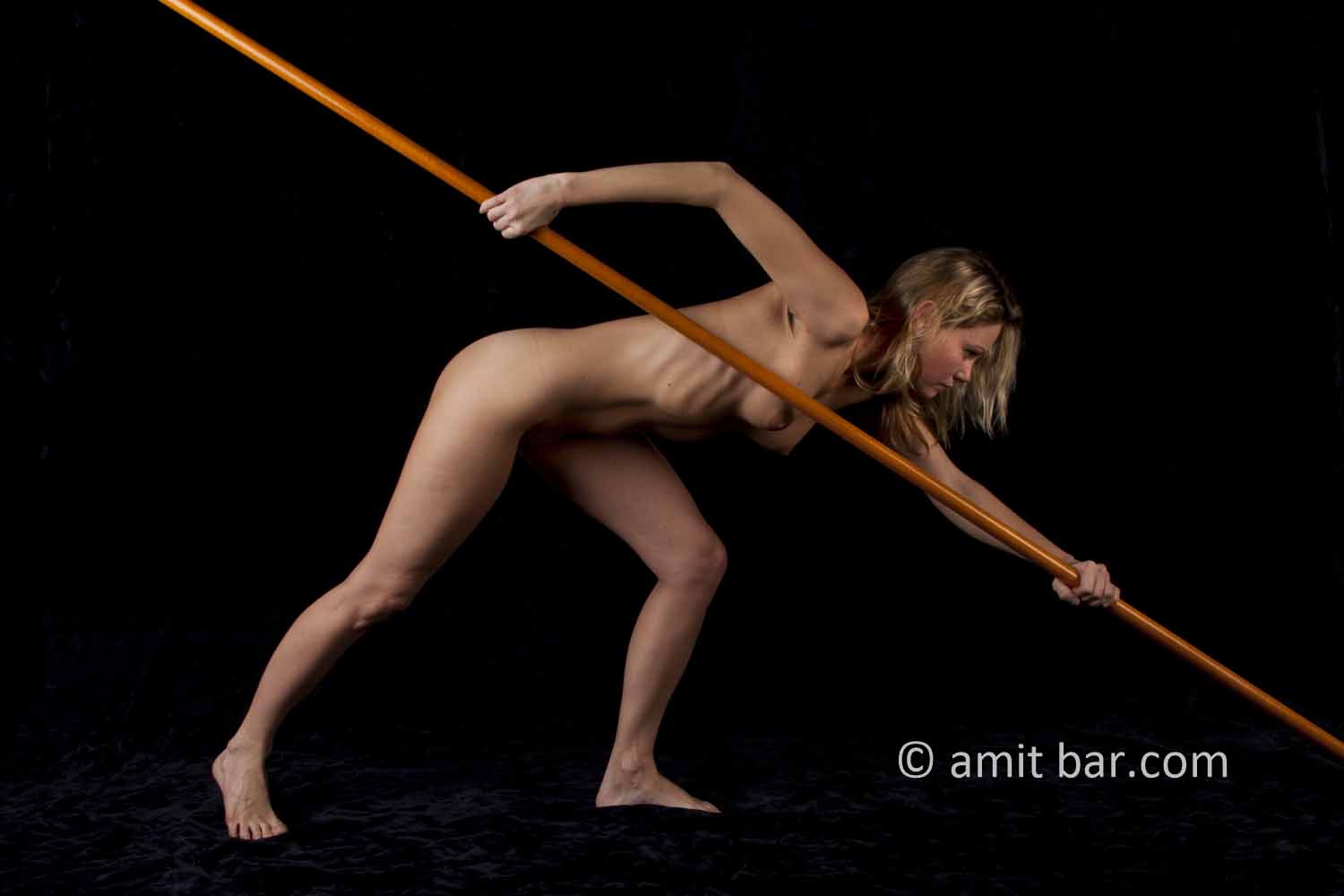Diagonal I: nude model with a wooden stick
