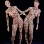 Different sisters II: Two body-painted sister-models