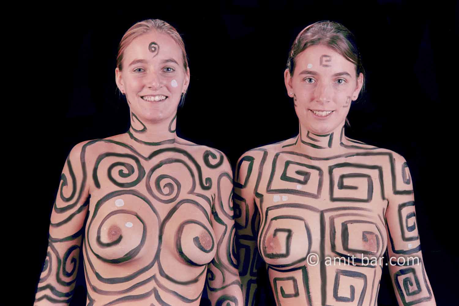 Different sisters III: Two body-painted sister-models