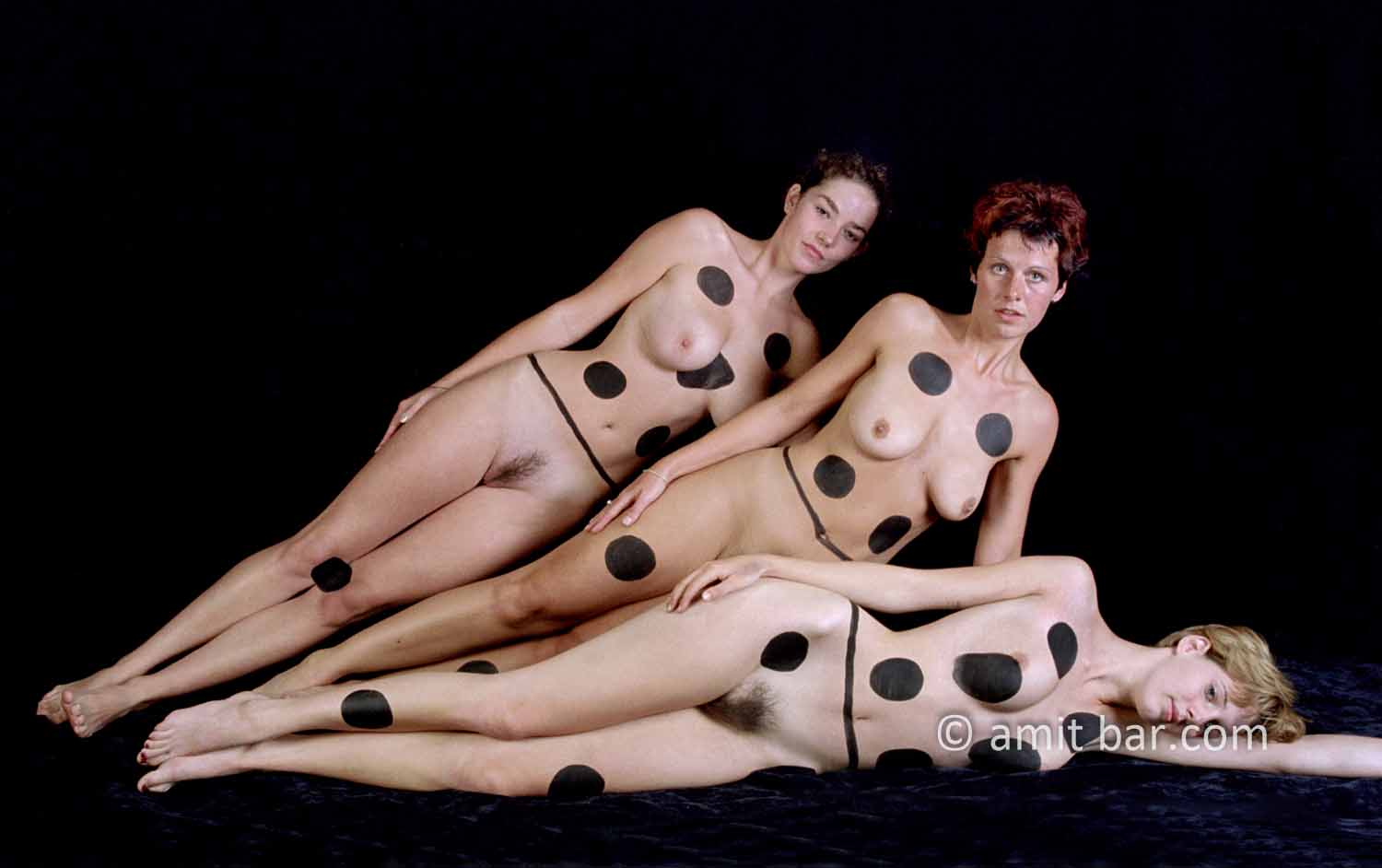 Dominos II: Three body-painted models as domino-blocks