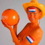 Dutch soccer III: Body-painted model in orange and a football