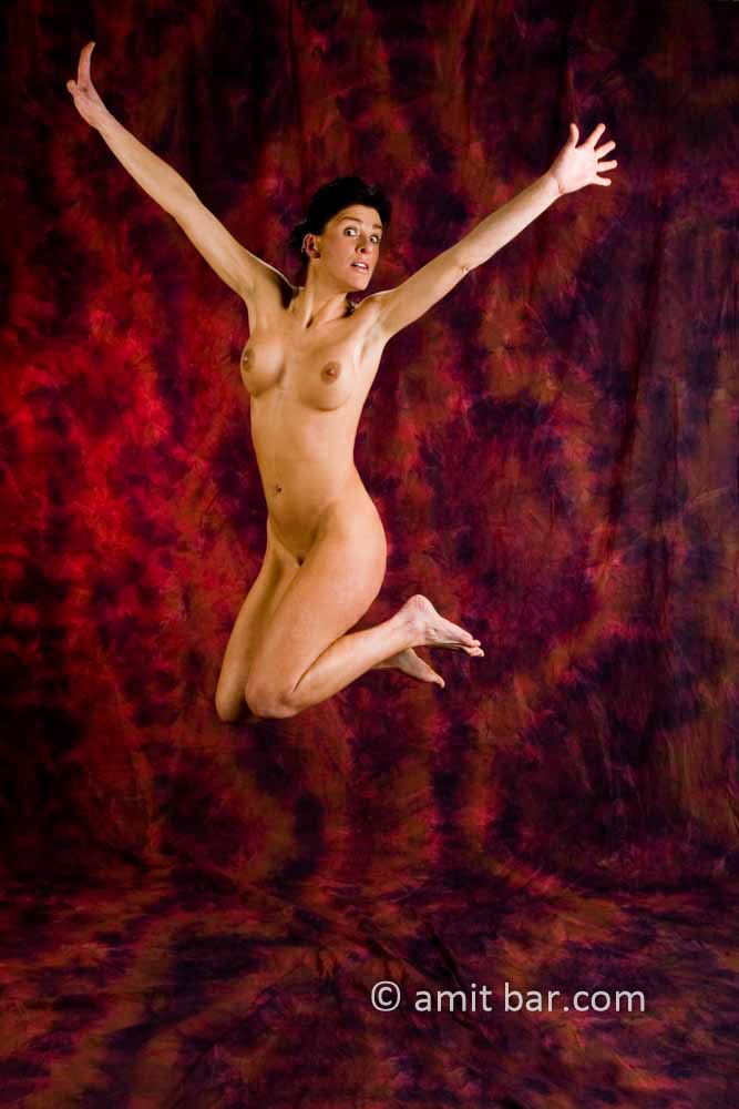 Fighter I: Nude model jumping in the air