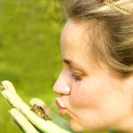 Frogs: Kiss the prince III: Body-painted model in a field with dandelions