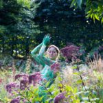 Garden flowers portrait: Portrait of a body painted model among garden flowers
