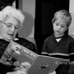 Generations III: Granmother is reading a story to her grandson
