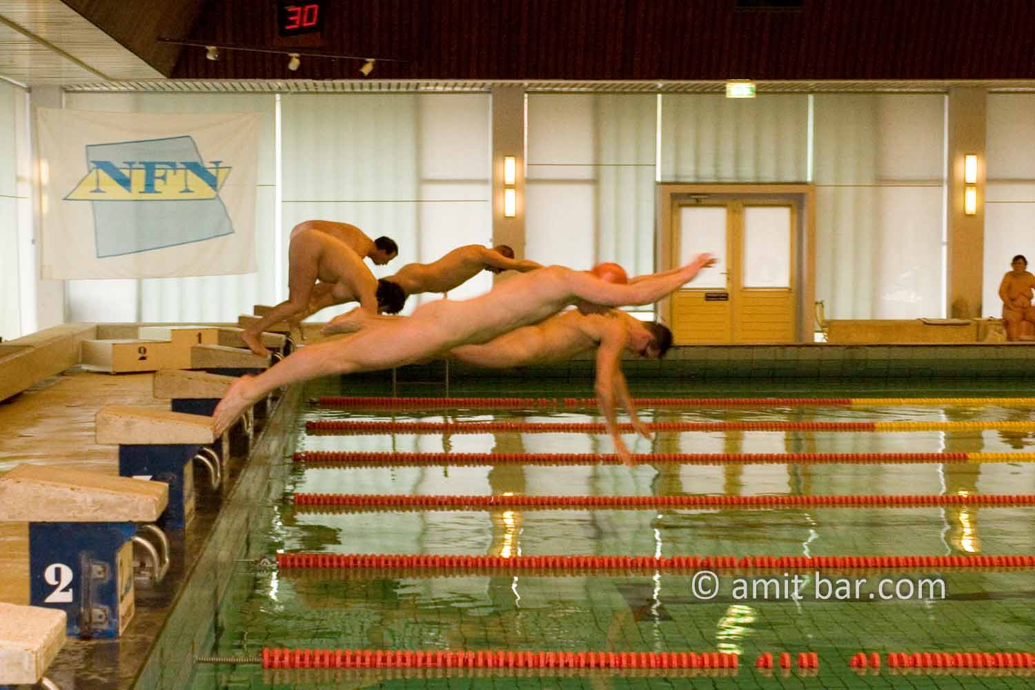 Go!: Swimmers springen on their race at the yearly championship of the Dutch National Federation of Naturiists.