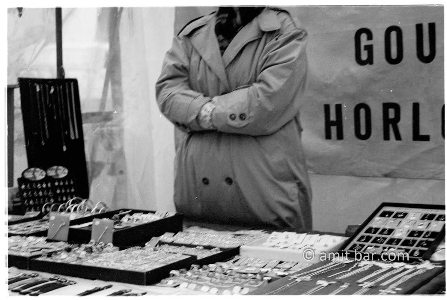 Golden hands: A open market seller of golden watches in Doetinchem is hiding his hands in his sleeves on a cold day