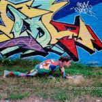 Graffity attack I: Body-painted model with graffity-wall