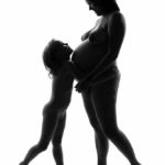 Happy family III: Pregnant mother and her daughter