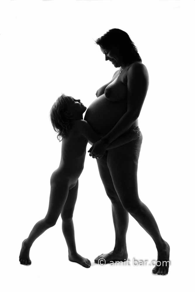 Happy family III: Pregnant mother and her daughter