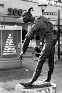 Harlequin: The sculpture of the famous clown Harlequin has been "decorated" with ice-cream cone. Arnhem, The Netherlands